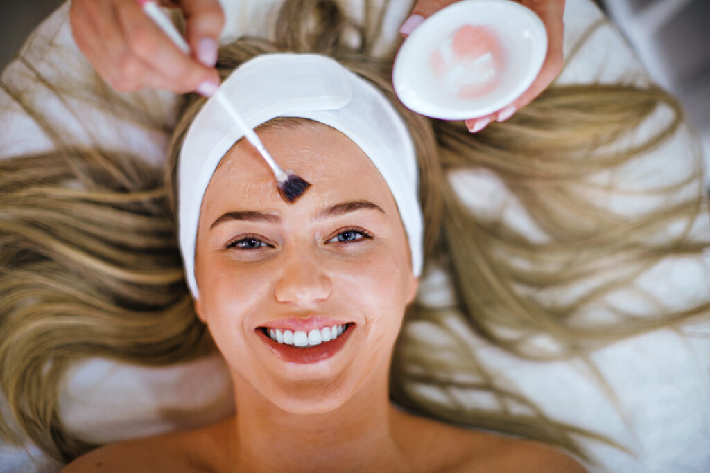 Woman receiving a facial skin treatment at a medical spa.
