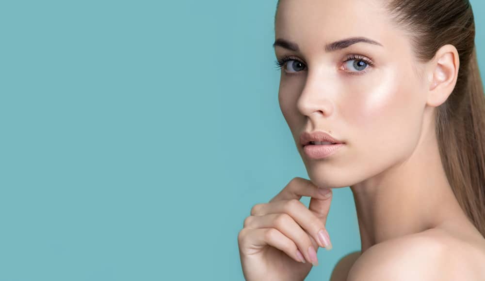 Woman with fresh, glowing skin after skincare treatment for fall. Woman with fresh, glowing skin after skincare treatment for fall.