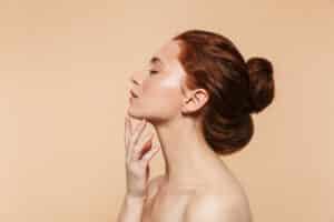 Woman with smooth, glowing complexion after IPL treatment in Encino, CA